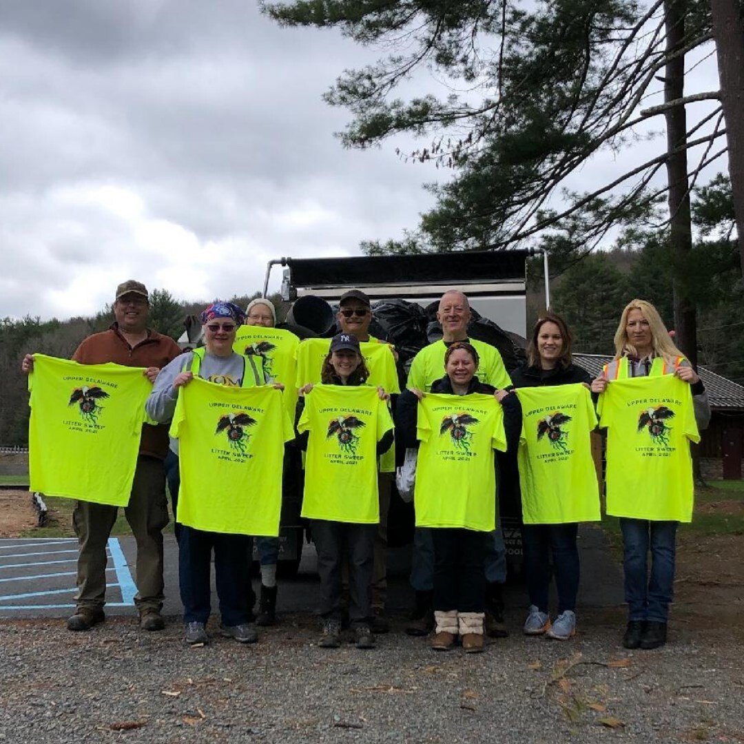 Team Lackawaxen proudly displays the Upper Delaware Litter Sweep T-shirts they earned while collecting 1,300 pounds of roadside trash during a four-hour pick-up along three miles of Masthope Plank Road in Lackawaxen Township, PA on the first day of the April 17-25 event coordinated by the Upper Delaware Council. The intrepid team included Jeff “JT” Thompson, left, Ellen O’connor, Eileen Ahearn, Brenna O’connor, Jeffrey Shook, Dennis Ahearn, Jackie Decatur, Heather Clark, Lynn Mills, and behind the camera, Eric Thompson.